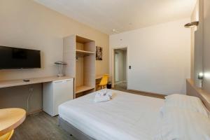 Letto o letti in una camera di Sleep & Go Brussels South