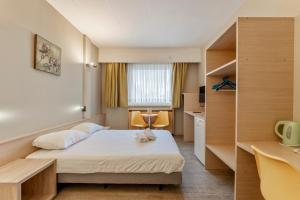 Letto o letti in una camera di Sleep & Go Brussels South