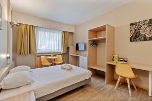 Letto o letti in una camera di Sleep & Go Brussels South