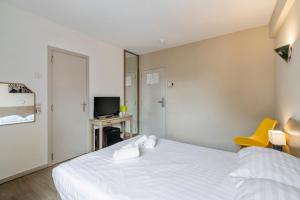 Letto o letti in una camera di Sleep & Go Brussels South
