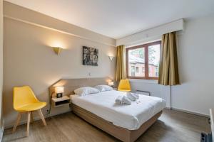 Letto o letti in una camera di Sleep & Go Brussels South