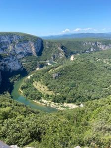 an aerial view of a river in a canyon at La Perline, Maison individuelle - 4 à 6 personnes in Le Crestet +13 photos