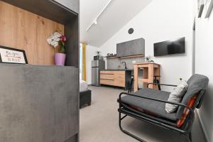 Μια τηλεόραση ή/και κέντρο ψυχαγωγίας στο Lity Apartment Lily