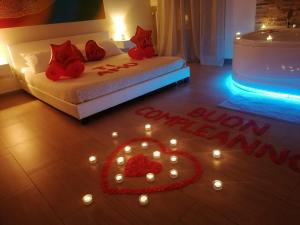 Postel nebo postele na pokoji v ubytování B&B La Perla & Suites