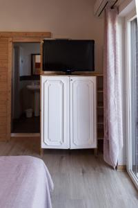Телевизор и/или развлекательный центр в Villa Lina Bed&Breakfast