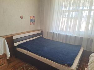 Postel nebo postele na pokoji v ubytování Visit Balykchy