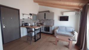 a small kitchen with a table and a chair at Ionian Moon 2 in Preveza