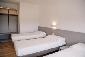 Postel nebo postele na pokoji v ubytování K Modern Apartments