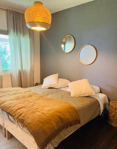 Postel nebo postele na pokoji v ubytování Superbe Appartement avec vue sur le Lac du Bourget
