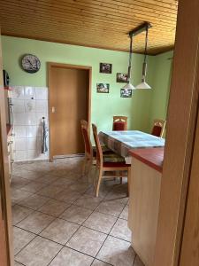 a kitchen and dining room with a table and chairs at Ferienhaus in Grevesmühlen