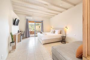 A bed or beds in a room at Dominoes Corfu