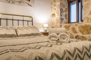 a bedroom with a bed and a window and a window at Casa de Mamachon in Cazorla +27 photos