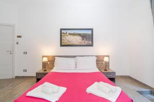 Postel nebo postele na pokoji v ubytování Cavour Rooms