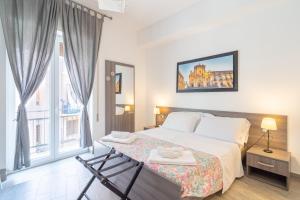 Postel nebo postele na pokoji v ubytování Cavour Rooms