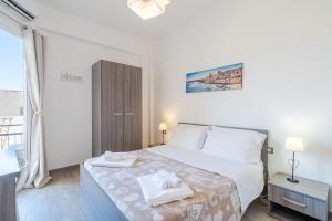 Postel nebo postele na pokoji v ubytování Cavour Rooms
