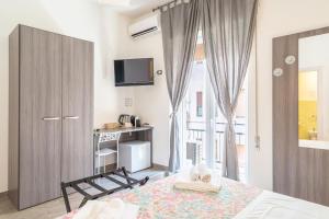 Postel nebo postele na pokoji v ubytování Cavour Rooms