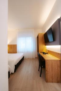 Postel nebo postele na pokoji v ubytování Hotel Everest