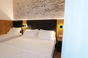 Postel nebo postele na pokoji v ubytování Hotel Everest