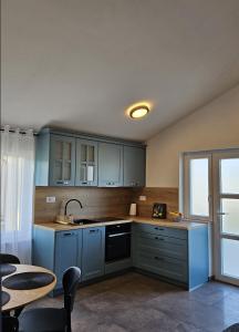 Kuchyňa alebo kuchynka v ubytovaní Apartments Brajde