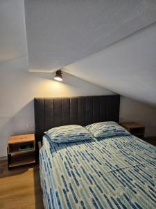 Posteľ alebo postele v izbe v ubytovaní Apartments Brajde