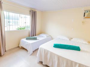 Ένα ή περισσότερα κρεβάτια σε δωμάτιο στο Casa para até 10 pessoas com churrasqueira QF1846