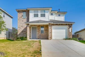 a white brick house with a garage at San Antonio Home with Pool Access 11 Mi to SeaWorld in San Antonio