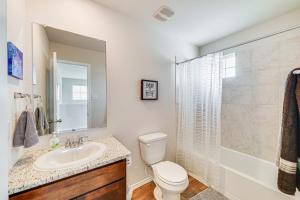 a bathroom with a sink and a toilet and a shower at San Antonio Home with Pool Access 11 Mi to SeaWorld in San Antonio +22 photos