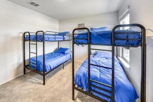 a bedroom with two bunk beds in a room at San Antonio Home with Pool Access 11 Mi to SeaWorld in San Antonio