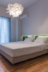 Posteľ alebo postele v izbe v ubytovaní ABA Apartment Korizi street