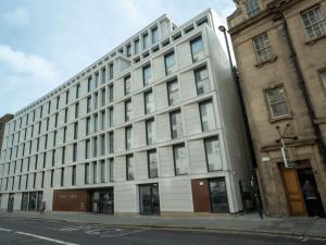 a large white building on the corner of a street at For Students Only Market House in Newcastle in Newcastle upon Tyne