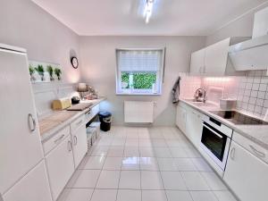 Kuchyň nebo kuchyňský kout v ubytování Gästehaus Backes + 9 fotografií