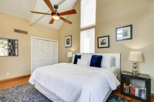 a bedroom with a white bed and a ceiling fan at Balcony and Views Pet-Friendly Indian Wells Unit in Indian Wells +20 photos