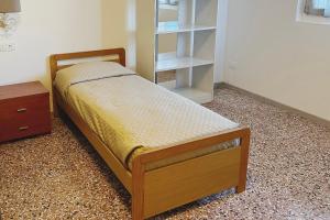 Una cama o camas en una habitación de Rustico da Pina con angolo cottura