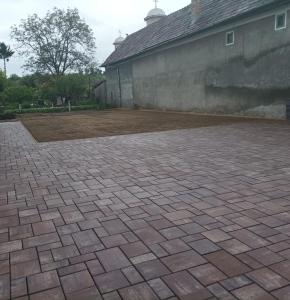 a brick patio in front of a building at Casa Taramului in Turda