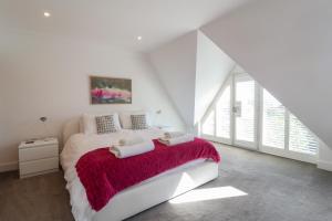 En eller flere senge i et værelse på Crabapple Cottage, Southwold