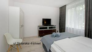 Posteľ alebo postele v izbe v ubytovaní Twój Salon-Apartamenty Stare Miasto