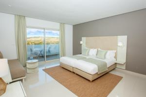 Letto o letti in una camera di Lixus Beach Resort - All In