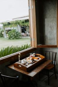 a tray of food sitting on a table next to a window at Casa Mar in Prado