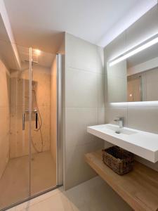 a bathroom with a sink and a shower at Premium surf lodge in Capbreton +19 photos