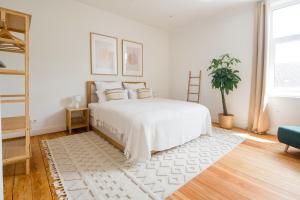 Postel nebo postele na pokoji v ubytování Modern Boho auf 145qm, 9 Gäste, Strandnah & Familienfreundlich