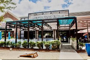 a restaurant with a sign that reads marocota emprises at Medical Center Rice Village Condo in Houston