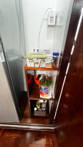 a small shelf in a bathroom with a refrigerator at Temporarios en Avellaneda Centro in Avellaneda +8 photos