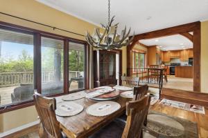 a dining room with a wooden table and chairs at Ridgeline Views in Boone