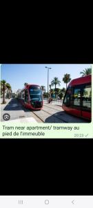 a red bus is parked next to a bus at Grand Appartement, 2 ou 3 ou 4 pieces, tramway sur place, proche gare sncf St Augustin 5 min, aéroport à 7 min, plage ou Allianz riviera 10 min, palais nikaia 2 min , supermarché sur place, parking possible si disponible ou payant à 1000 metre in Nice