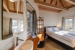 Postel nebo postele na pokoji v ubytování Resort Schloss Rued