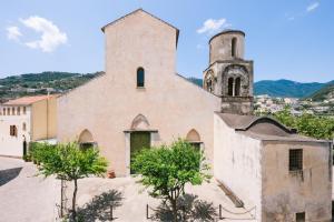 an old church with a tower and a steeple at Na Stanza in centro in Ravello