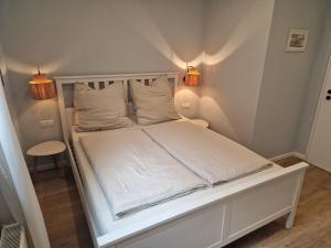 Postel nebo postele na pokoji v ubytování Haus am Markt