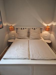 Postel nebo postele na pokoji v ubytování Haus am Markt