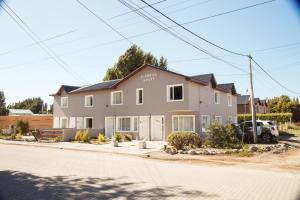 a house on the side of a street at Alameda Reserve Apart in El Calafate