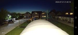 a view of a house with a large object in front at Holiday Homes 777 in Karwia